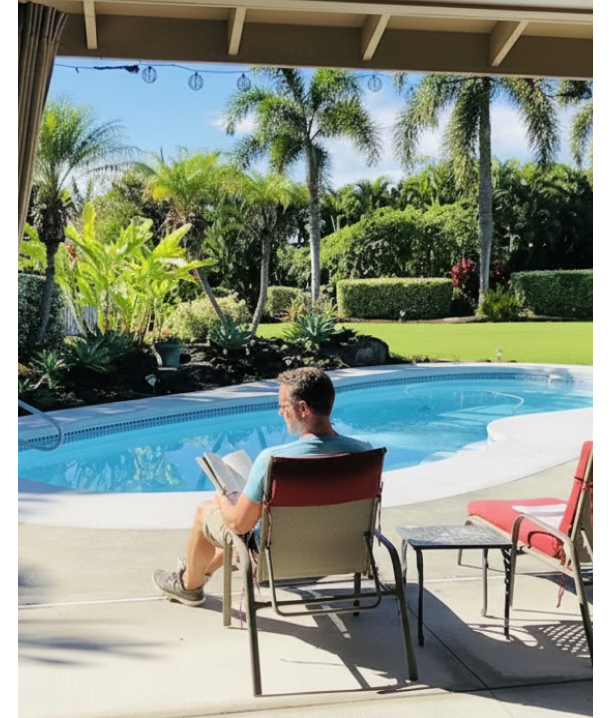 Man reading next to pool