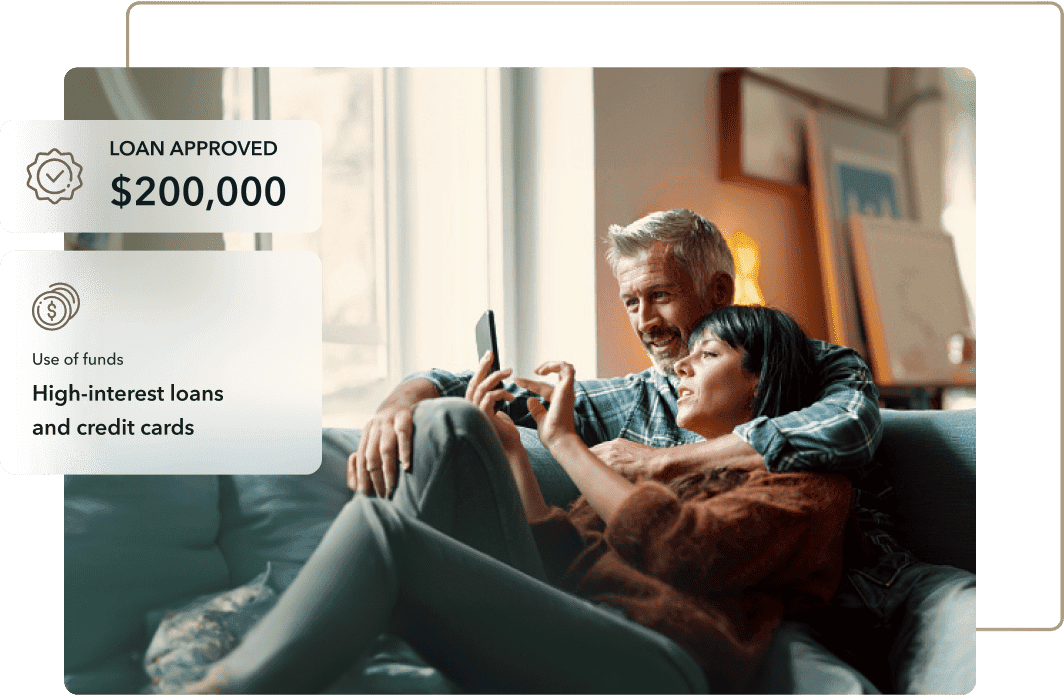 A couple sitting on a couch, smiling and looking at a smartphone. The image includes a graphic overlay with loan terms