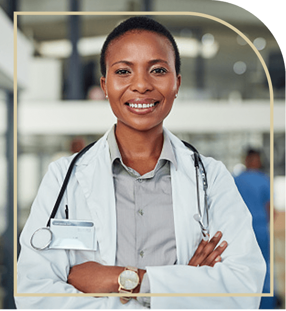 woman doctor smiling with her arms crossed