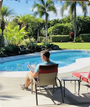 Man reading next to pool